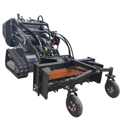 Mini skid steer loader with Harley Rake